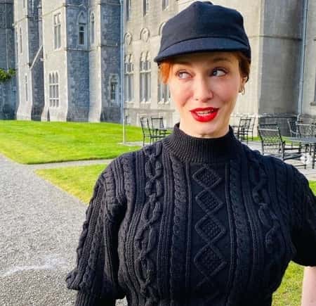 Christina Hendricks in front of a 800-year-old Castle after the divorce with her husband Geoffrey Arend